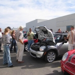 The owners gather to gawk at engines.