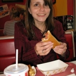 Jenny has a hot dog. It lives up to its adjective.