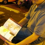Anthony shows us his motoring atlas. 2003 MINIs are not equipped with such wonders.