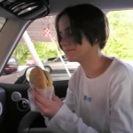 Jenny prepares herself for a cheeseburger. She deemed it excellent.