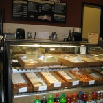 Inside the cafe, calzones and pizza slices for sale.