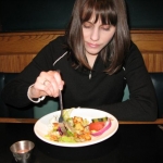 Jenny enjoys the house salad.