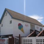 Scoopy's quaint barnlike building with neon accented ice cream cones. Scoopy's quaint barnlike building with neon accented ice cream cones.