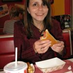 Jenny has a hot dog. It lives up to its adjective. Jenny has a hot dog. It lives up to its adjective.