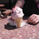 My cone runneth over. This photo is merely 60 seconds after the cone has been filled and yet has the appearance of four minutes in the hot sun. Though runny, the strawberry flavor of the day was delicious. My cone runneth over. This photo is merely 60 seconds after the cone has been filled and yet has the appearance of four minutes in the hot sun. Though runny, the strawberry flavor of the day was delicious.