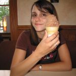 Jenny enjoys her chocolate custard. Jenny enjoys her chocolate custard.