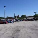 The overflow of goodwill MINIs surrounds the parking lot.