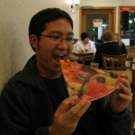 Anthony nearly eats his plate with anticipation.