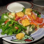 Emily went healthy and got a salad with dinner.