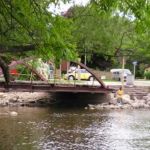 A small island park on a river in Watertown