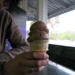 Jenny likes her chocolate cone. Jenny likes her chocolate cone.