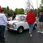 A classic Mini 1000 shows up and draws a crowd. A classic Mini 1000 shows up and draws a crowd.