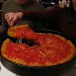 There's the pizza! A delicious deep dish with sausage and pepperoni. There's the pizza! A delicious deep dish with sausage and pepperoni.
