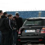 Heidi receiving instruction on how to flip a 180 at the Driver Training Course