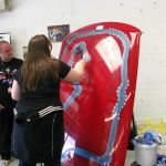 Heidi playing the race track spray gun game