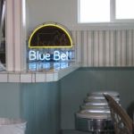 Blue Bell neon sign and retro seating area at the counter. Blue Bell neon sign and retro seating area at the counter.