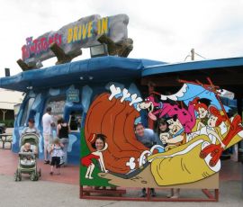 The Flintstones Drive-in does serve Bronto Burgers. I imagine they're a bit smaller than pictured.