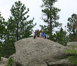 Emily and Jenni climb the rock face to the top. Jenny and Caren found a less treacherous path. Emily and Jenni climb the rock face to the top. Jenny and Caren found a less treacherous path.