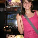 Jenny, with the machine that ate her money and the hand stamp proving she's old enough to have lost it.