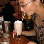 Jenni and her delicious, teeming raspberry milkshake with a layer of raspberry at the bottom!