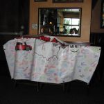 The MINIs Motoring against Cancer banner.