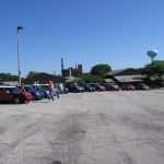 The overflow of goodwill MINIs surrounds the parking lot. The overflow of goodwill MINIs surrounds the parking lot.