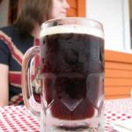 A tall frosty mug of John's Root Beer